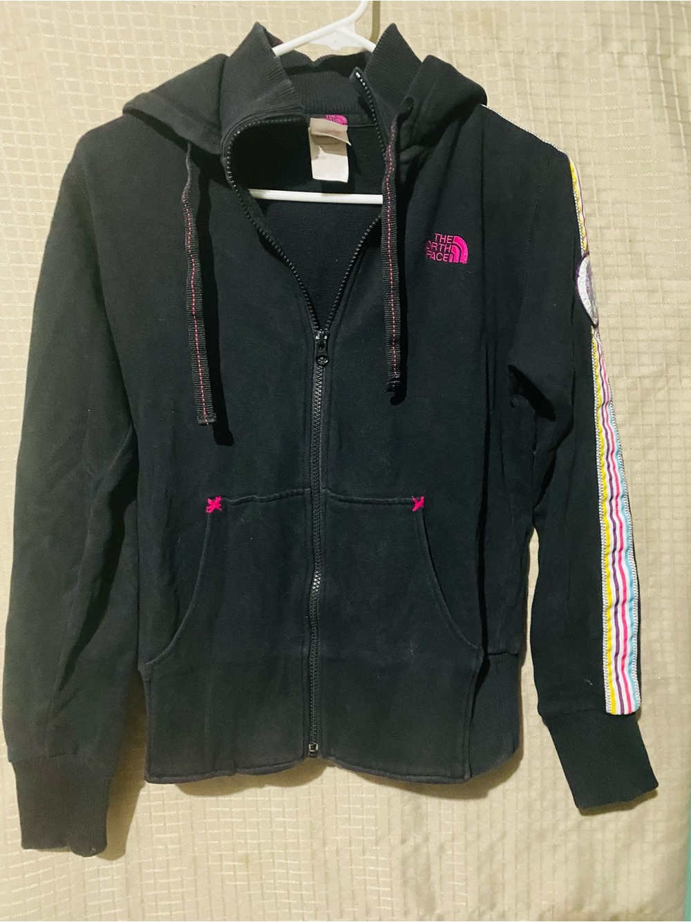 The North Face Black Zip Hoodie with Pink Logo and Multicolor Sleeve Stripe